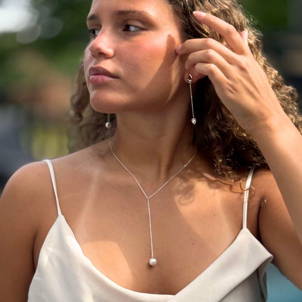 Silverörhänge och halsband med pärla