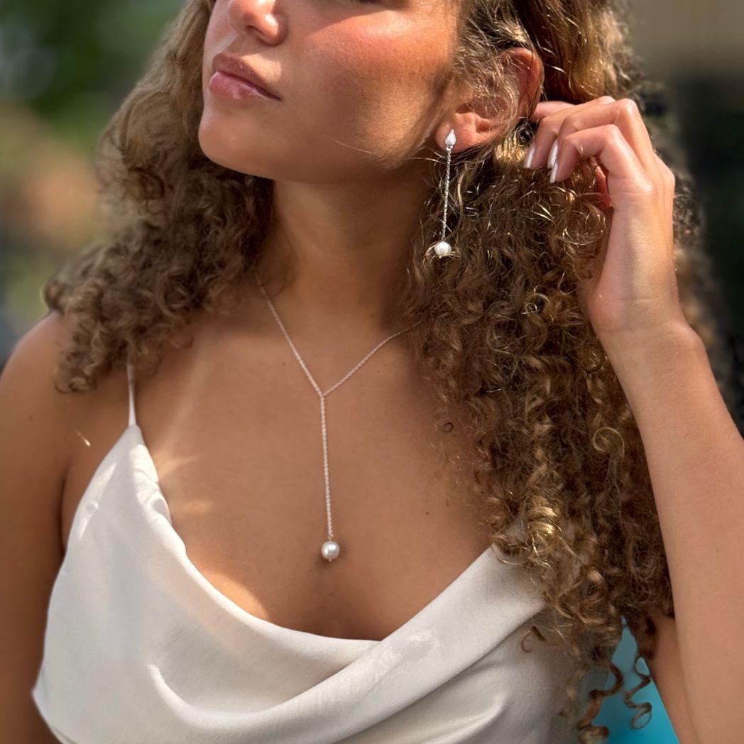 Silverörhänge och halsband med pärla