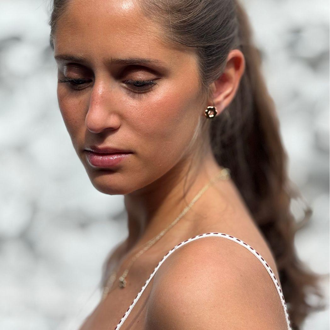 Halsband med i formen av Daisy och örhänge i guld från Daisy Collection 
